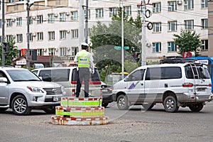 Mongolian policeman doing traffic in Ulaanbataar