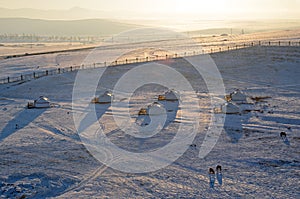 Mongolian steppe with yurt camp in winter evening. Top view from Genghis Khan Equestrian Statue