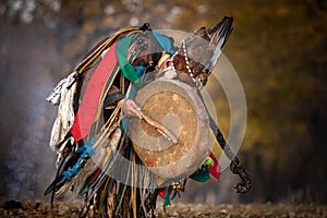 Mongolian shaman performing a ritual photo