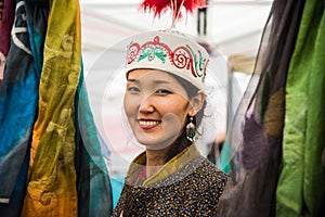 A mongolian woman selling silks and handcrafts from Mongolia. She was working as volunteer in the 4th edition of the United Nation