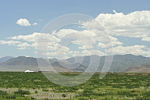 Mongolian yurts among the steppe and mountains of Altai.