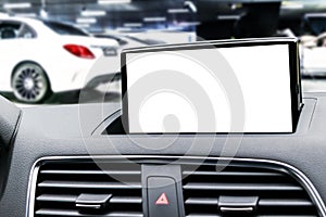 Monitor in car with isolated blank screen use for navigation maps and GPS. Isolated on white with clipping path. Car detailing. Mo