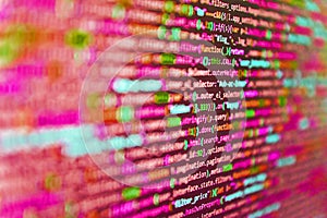 Monitor closeup of function source code. Binary computer code background, abstract. Database bits access stream visualisation.