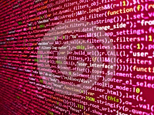 Monitor closeup of function source code. Software background technology. Developing programming binary code. Database bits access