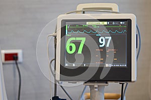 Monitor display for blood oxygen rate and heart rate  in patient room in the hospital