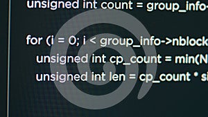 Monitor display of system engineer typing source code on terminal window