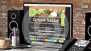 Monitor with Greek Salad recipe on desktop