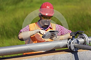 Monitor procces of filtering water, holding tablet