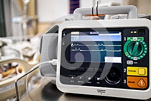 Monitor screen for medical defibrillator or emergency heart pump,showing vital signs,heart rate,slow beating pulse of a dying coma