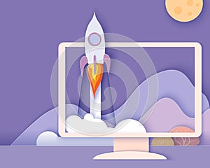 Monitor screen with mountains and rocket startup photo