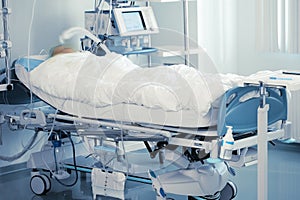 Monitoring of comatose patient in intensive care photo