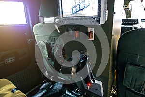 Monitoring and control system of a machine gun in a military armored vehicle