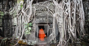 Monk in Angkor Wat Cambodia. Ta Prohm Khmer temple