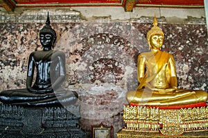 Monk black and golden image of Buddha