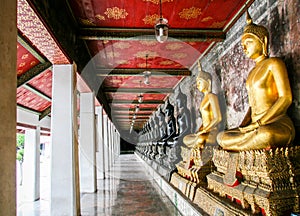 Monk black and golden image of Buddha