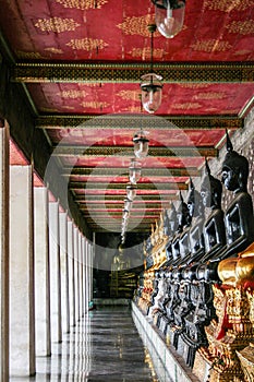 Monk black and golden image of Buddha