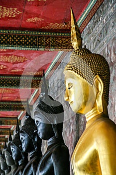 Monk black and golden image of Buddha
