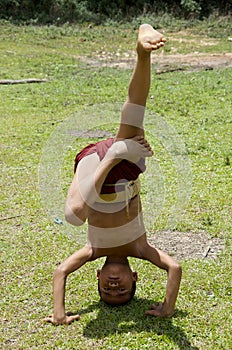 Monk child working on his handstands
