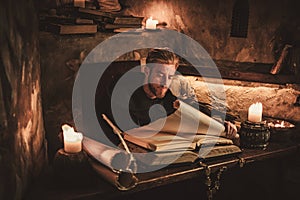 Monk chronicler writes an ancient manuscript