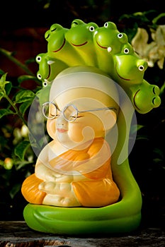 Monk doll meditating to luminosity photo