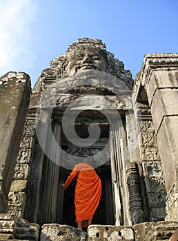 A monk enters Bayon Temple at Angkor Thom, Cambodia