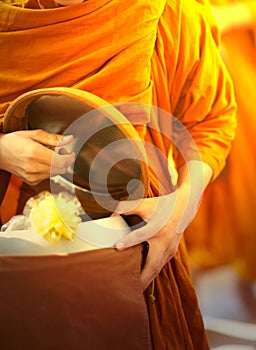 Monk is offered food by buddist