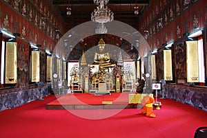 Monk praying in Wat Saket, Bangkok, Thailand, Asia