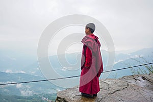 Monk on the rock. Sikkim, India