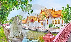 The monk`s sculpture in park of Wat Benchamabophit Dusitvanaram Marble Temple, Bangkok, Thailand