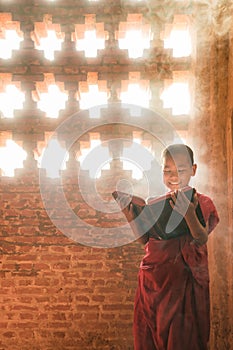 Monk standing reading scripture