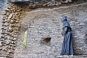 Monk statue in old town of Tallinn, Estonia