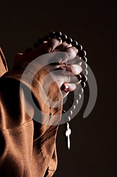 Monk with two hands clasped in prayer