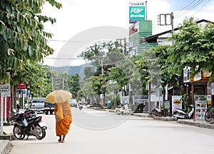 Monk walking in Pai, Thailand