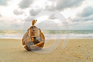 Monkey coconut sculpture at the beach