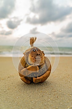 Monkey coconut sculpture at the beach