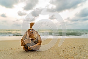 Monkey coconut sculpture at the beach