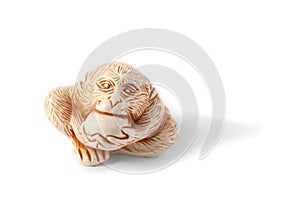 Monkey King. Sun Wukong. monkey eating peach. isolated on white background. Feng Shui. netsuke