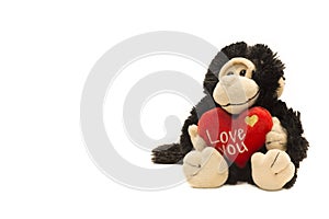 Monkey plushy toy with I Love U sign on white