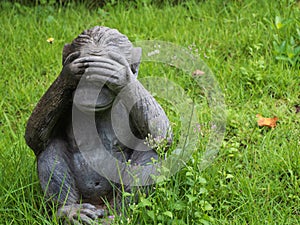 Monkey statue close eyes.