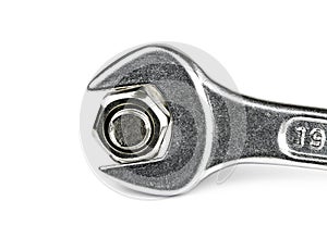 Monkey wrench and bolt nut on white background