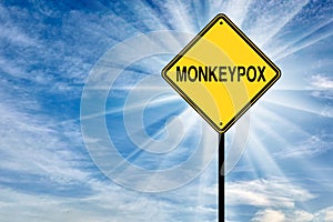 Monkeypox. Road warning sign with the word Monkeypox against the sky photo