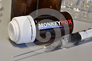 MonkeyPox virus. Syringe and vaccine. Treatment for New Virus MonkeyPox photo