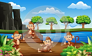 Monkeys cartoon hanging out on the wooden bridge