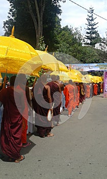 Monks going for a alms giving programme