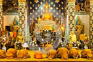 Monks praying in church photo