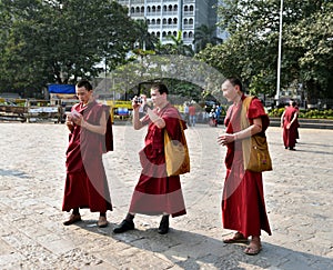 Monks taking photos