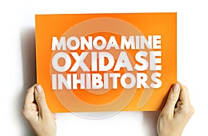 Monoamine Oxidase Inhibitors - class of drugs that inhibit the activity of one or both monoamine oxidase enzymes, text concept on