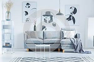 Monochromatic lobby with gray couch