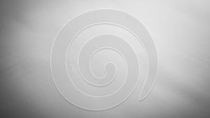 Monochromatic surface with a subtle gradient from light to darker gray