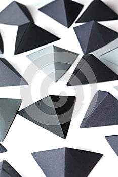 Monochrome black and gray tetrahedrons background.